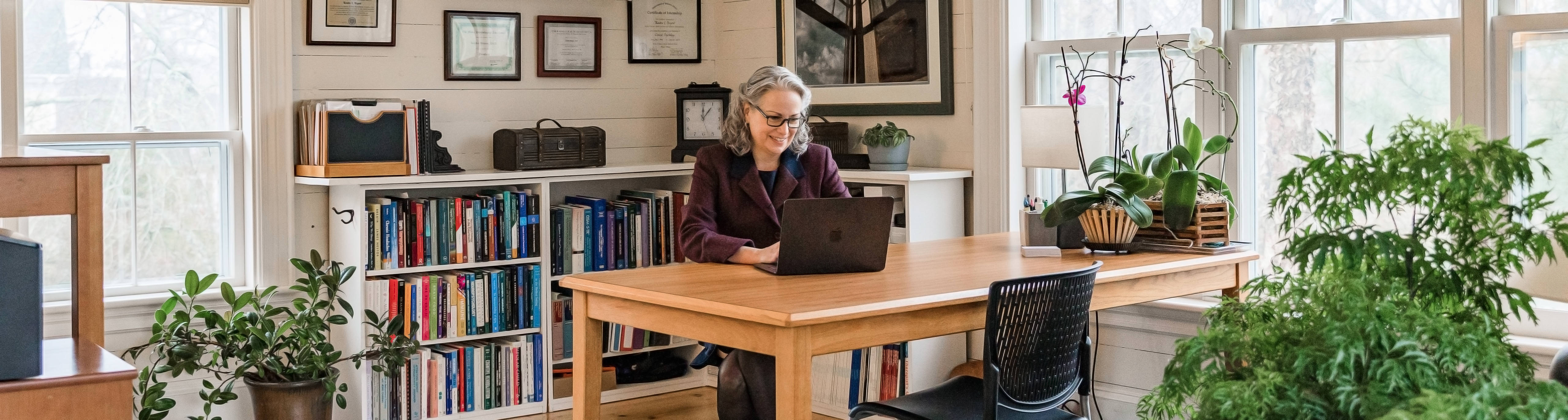 Dr. Kendra Bryant at her desk